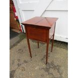 Mahogany veneered inlaid sewing box on castors