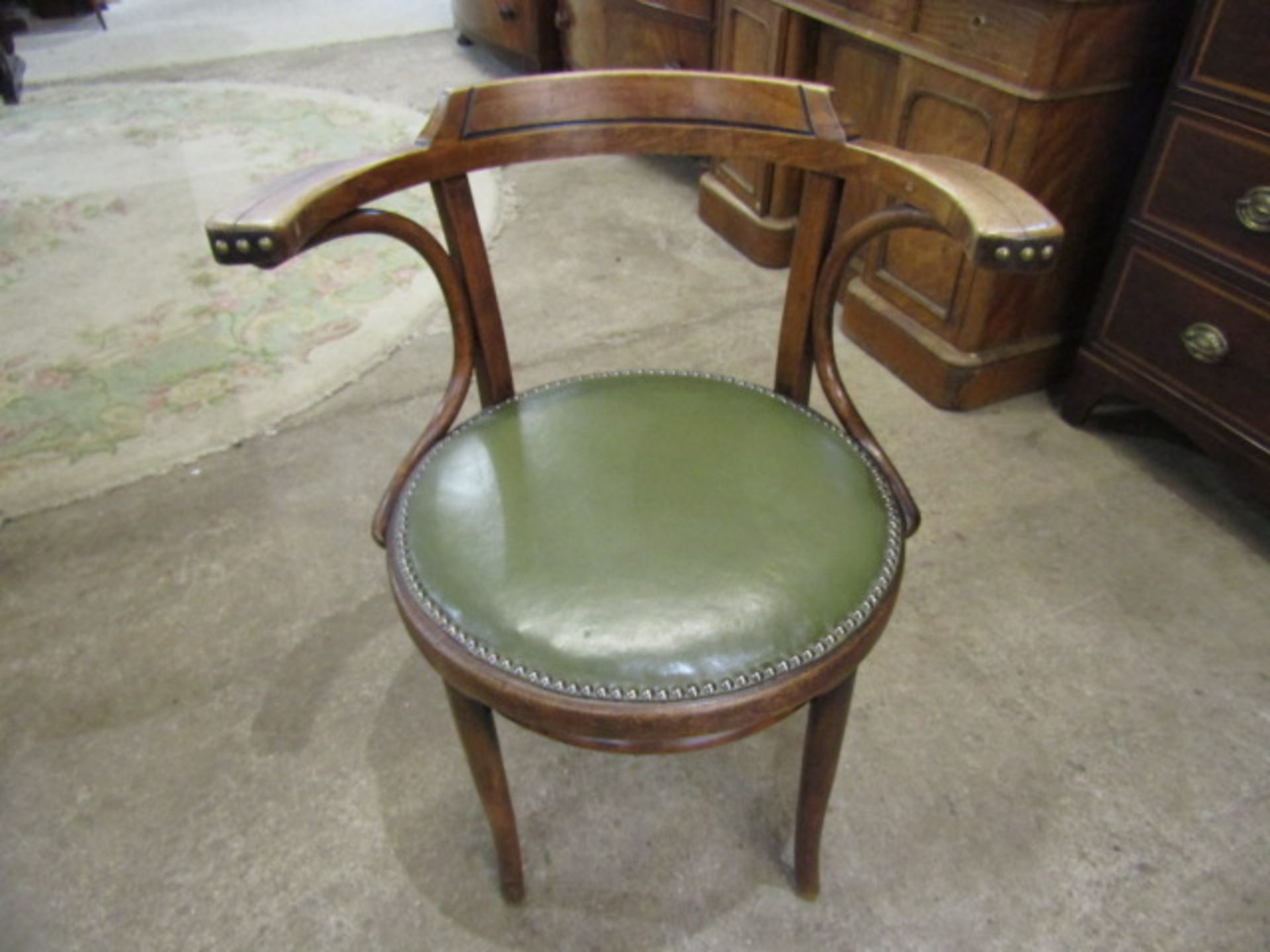 A bentwood penny seat chair with leather upholstered seat