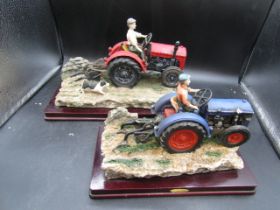 2 Juliano collection tractor ornaments. dogs tail broken on one and a chip on other