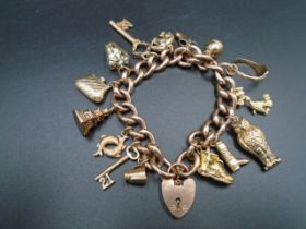 9ct rose gold heart lock charm bracelet marked on each link, has 15 different charms all but 3 are