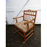 Upholstered wooden armchair