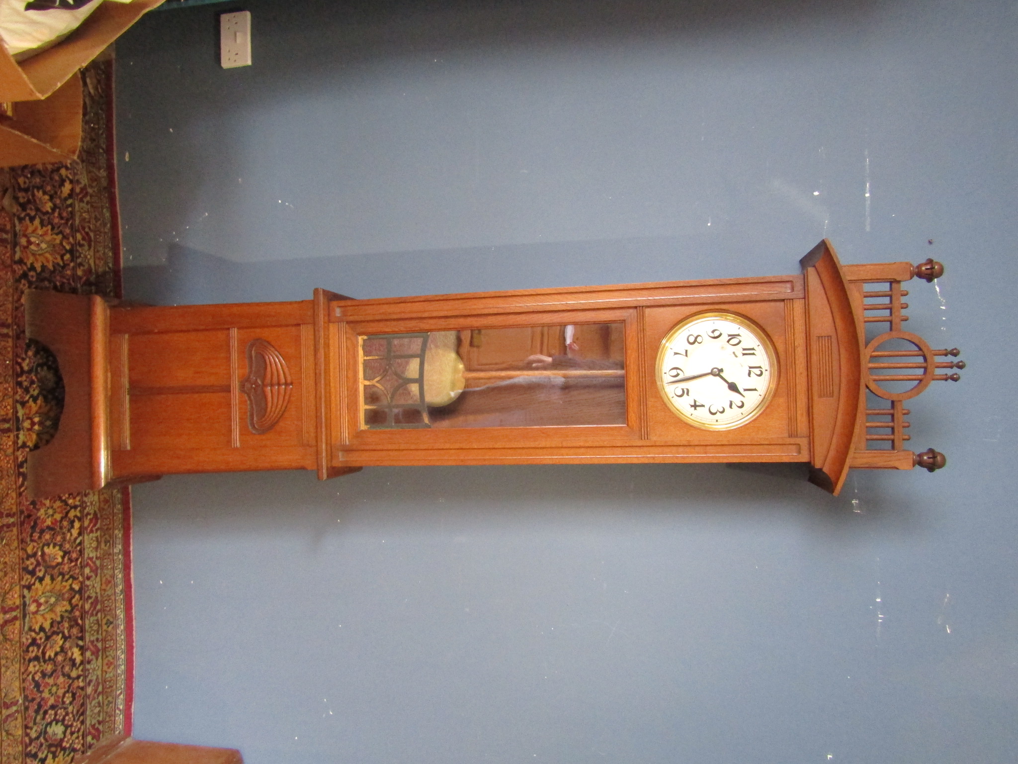 Early 20th Century Hamburg  American Clock Company longcase clock with weights and pendulum in oak