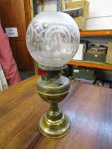 Brass based oil lamp with globe