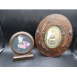 An antique wooden photo frame and a Bakelite? photo frame