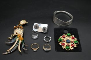 Costume jewellery - to include two brooches, rings and earings and a bracelet made in the form of