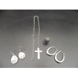 Sliver lot  - A silver cross on a chain, 2 pairs of 925 silver earings 'Wolf' pair by Jan Miller