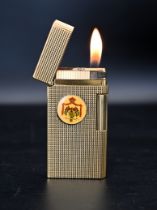 Caran D`ache Geneve gold plated cigarette lighter with the King Hussein of Jordan's insignia. The