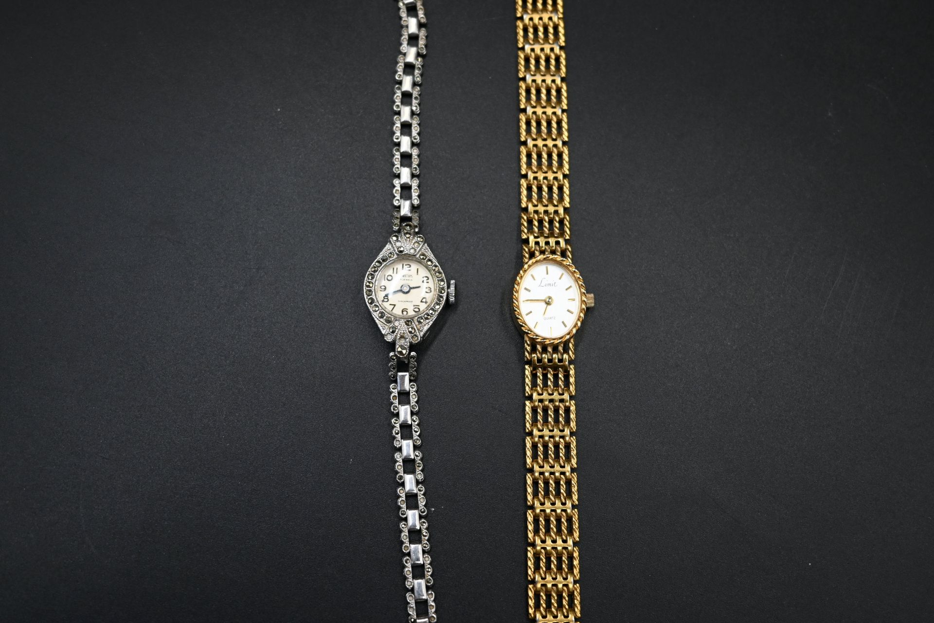 Smiths 5 jewels ladies marcasite art deco styly cocktail watch together with a Limit quartz watch