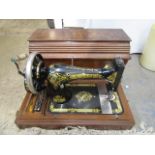 Vintage Singer sewing machine in wooden case