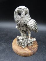 A silver owl on a wooden plinth, stamped with hallmarks and 'Langford  CA 1992' on the base 12cmH