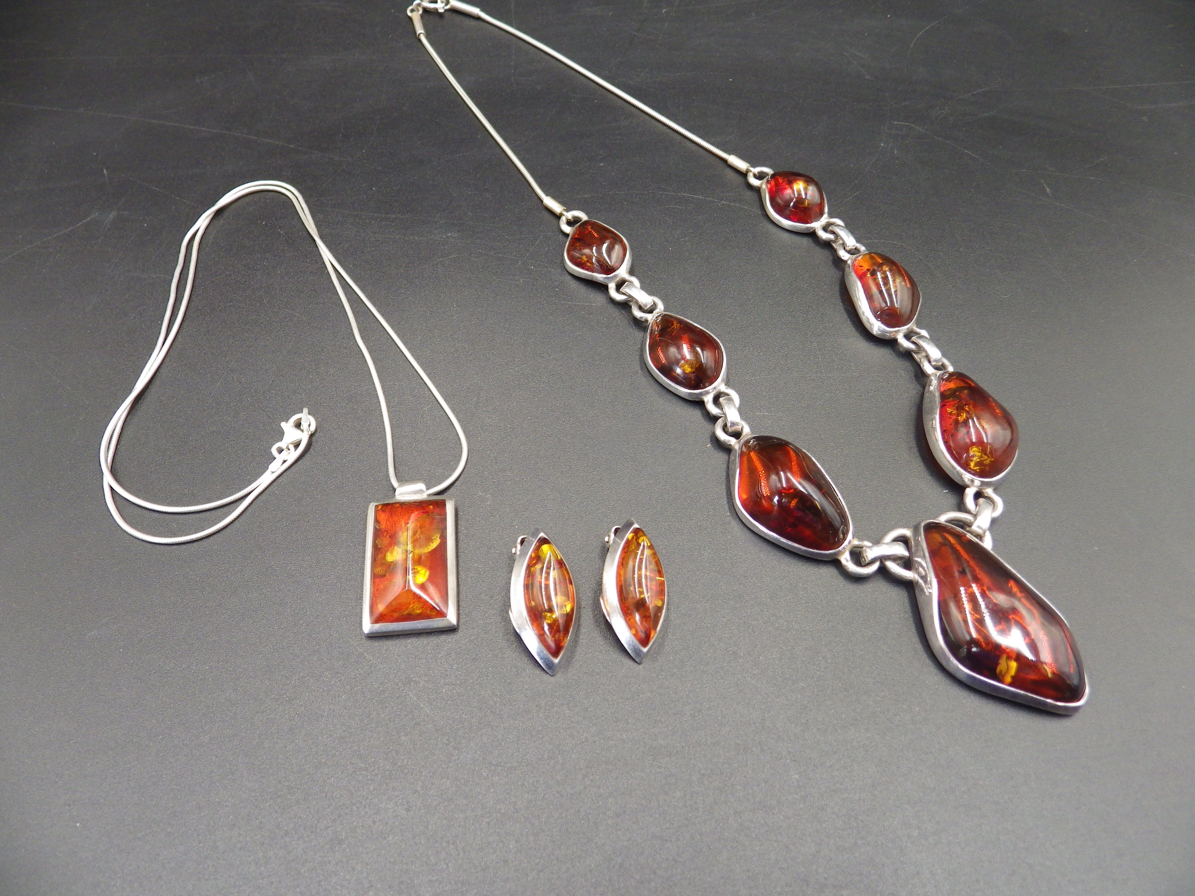 Sterling silver and amber necklace, plus an amber pendant and clip on earings