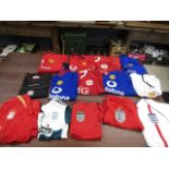 13 Football shirts- Man United, Liverpool and England and a pair shorts (Man U)