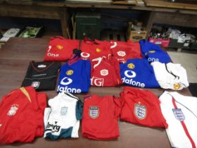 13 Football shirts- Man United, Liverpool and England and a pair shorts (Man U)