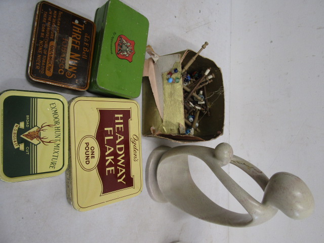 Vintage tins 'soapstone' figure and a box of vintage lace bobbins