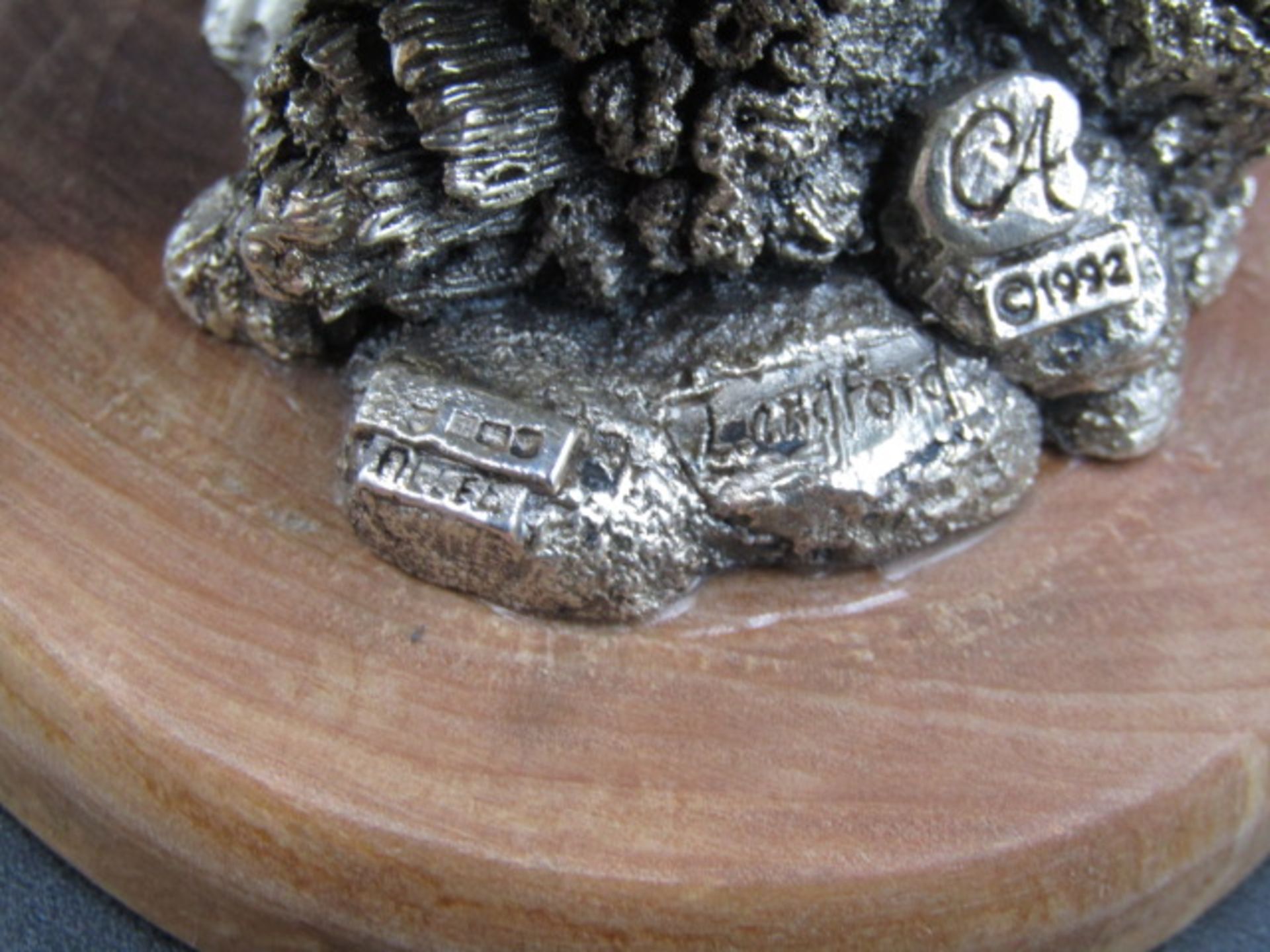 A silver owl on a wooden plinth, stamped with hallmarks and 'Langford  CA 1992' on the base 12cmH - Image 5 of 6