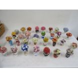 A collection 31 ceramic posies, stamped on base with symbol, all look to be in styles copying well