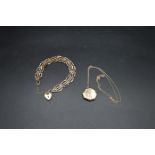 9ct gold gate bracelet together with a 9ct gold locket and chain total weight 8.45g