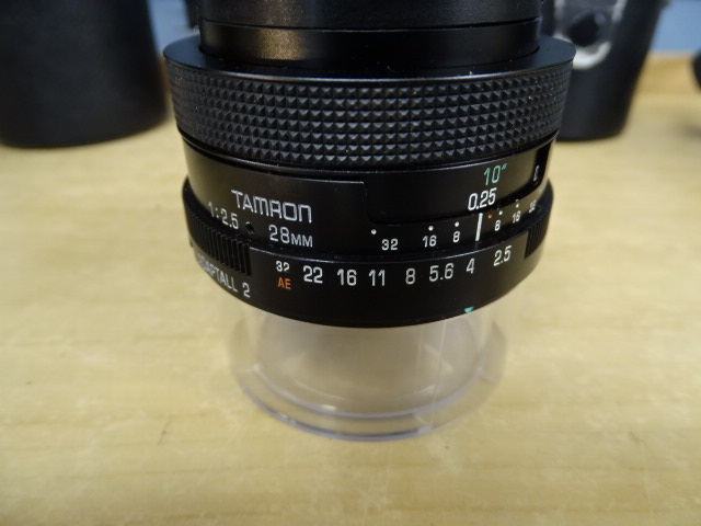Minolta SRT 100 camera with 3 lenses in bag - Image 5 of 7