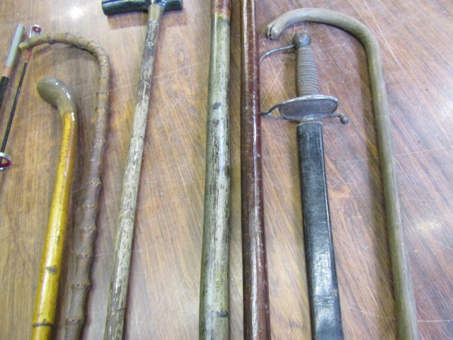 Various walking canes/sticks, a sword and a fishing rod - Image 5 of 6