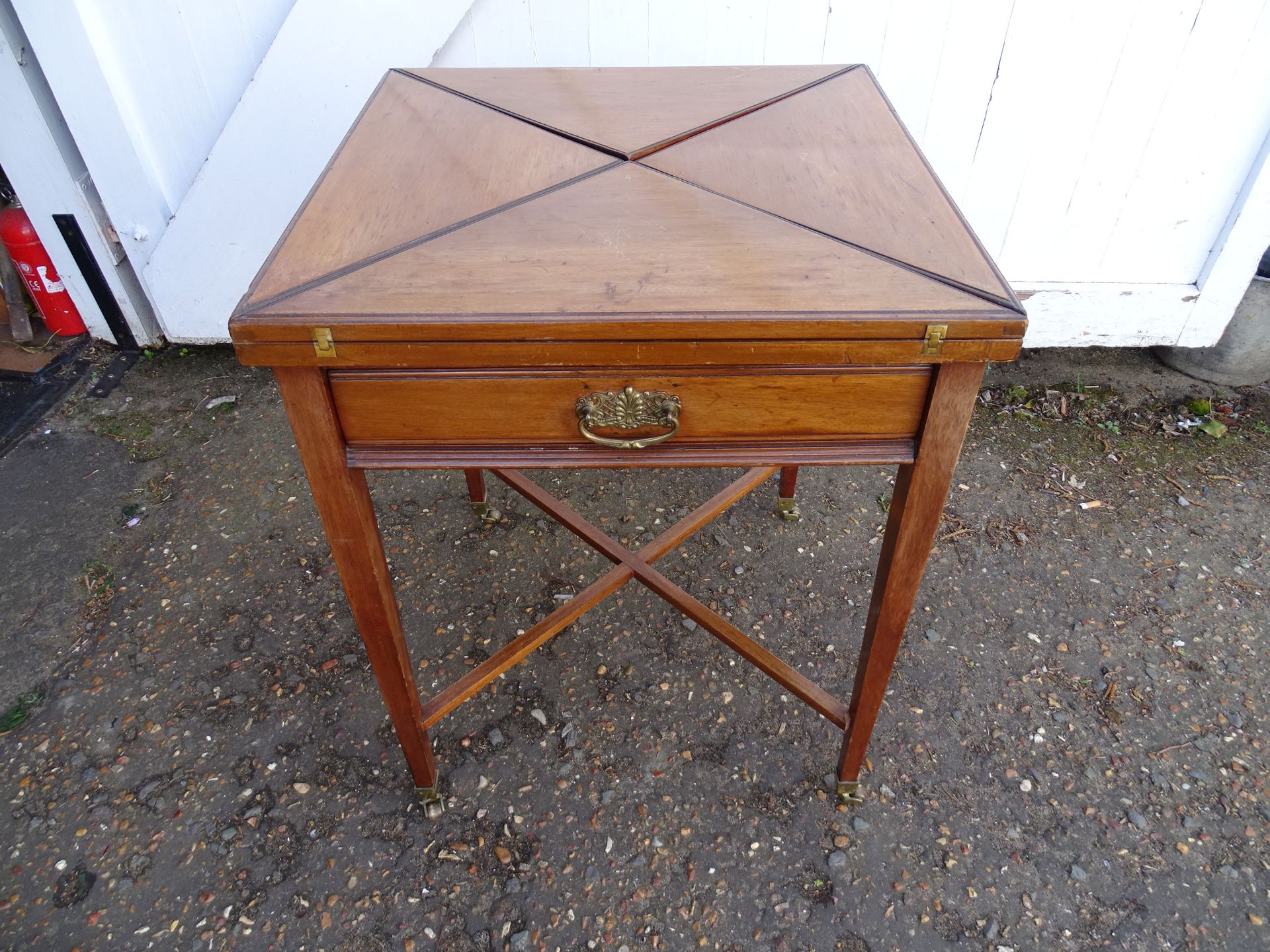 19th Century mahogany envelope card table with drawer on brass castors H70cm Top 56cm x 56cm approx