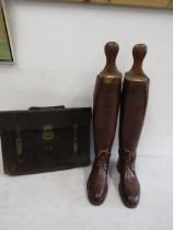 Military boots with wooden lasts and a leather bag