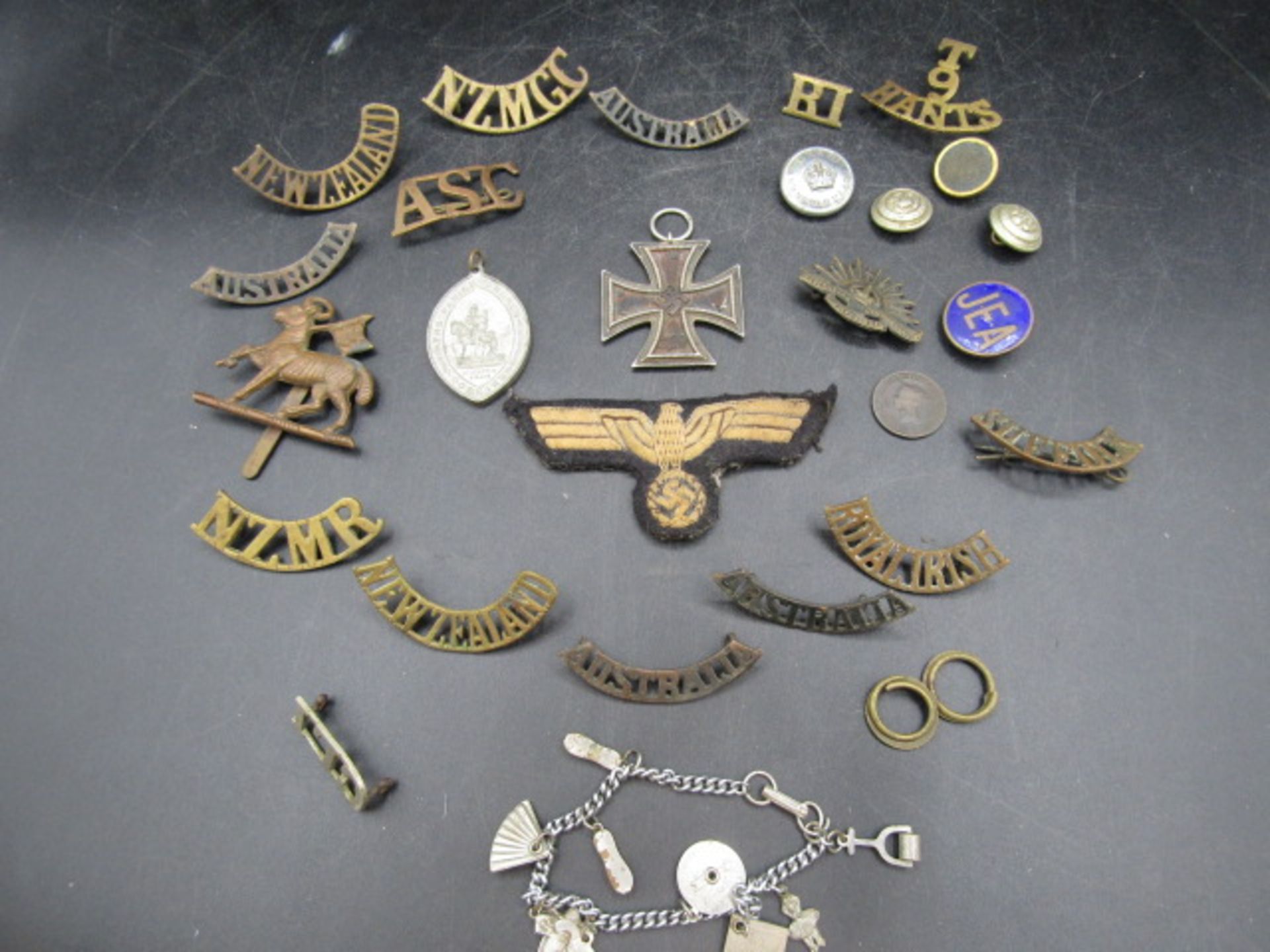 WW2 iron cross and various insignia badges and patches plus a charm bracelet - Image 7 of 9