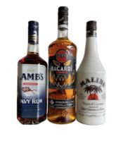 Three bottles of rum to include: Bacardi Spiced rum 35%vol 1Le  Lambs Navy rum 40%vol 70cl Malibu