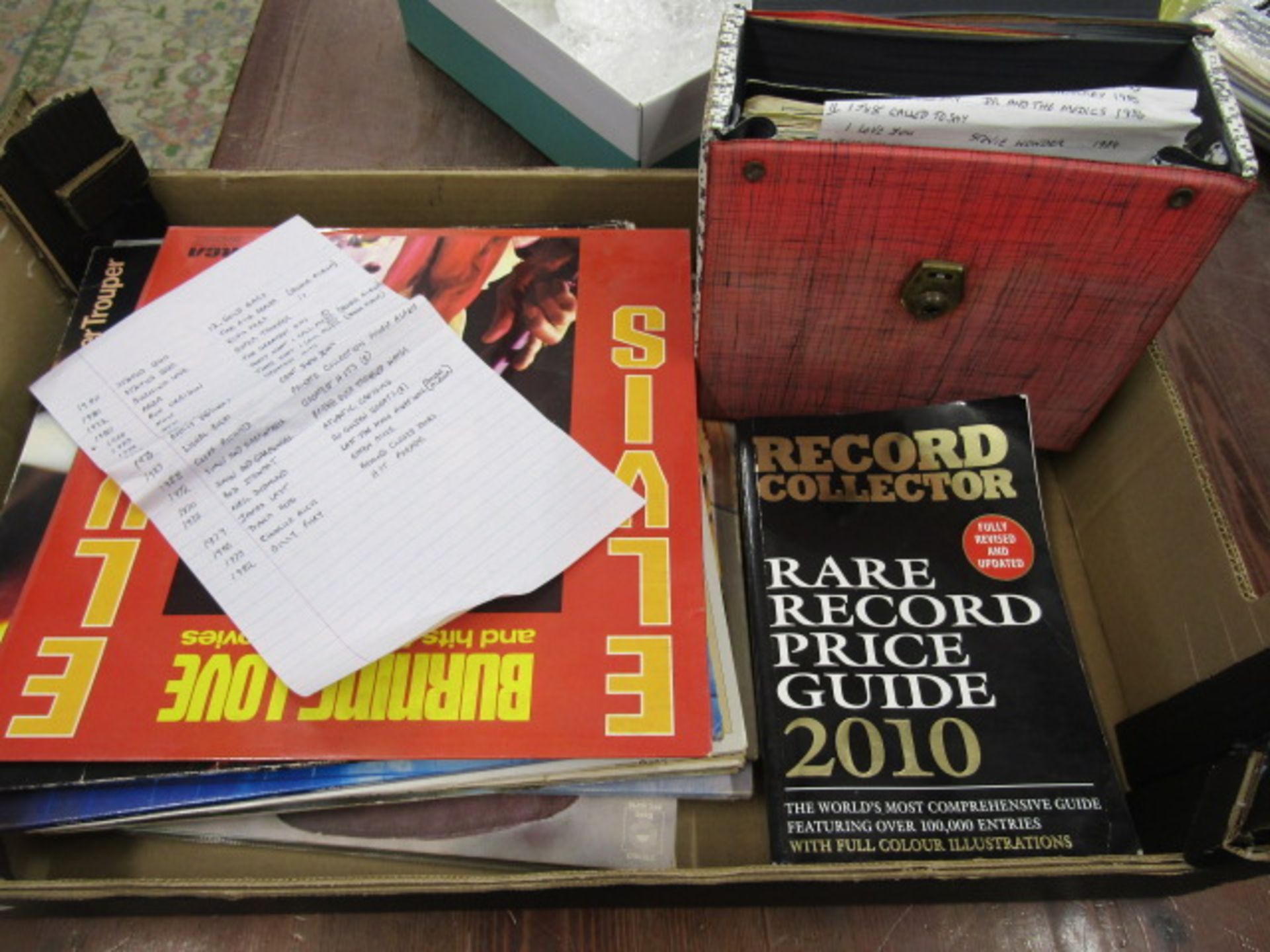 Box records, LP's and 45's- listed in pictures plus a record collectors book