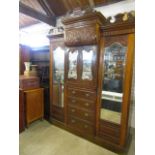 Antique heavily carved triple wardrobe