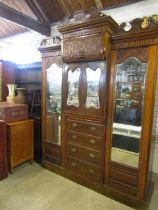 Antique heavily carved triple wardrobe