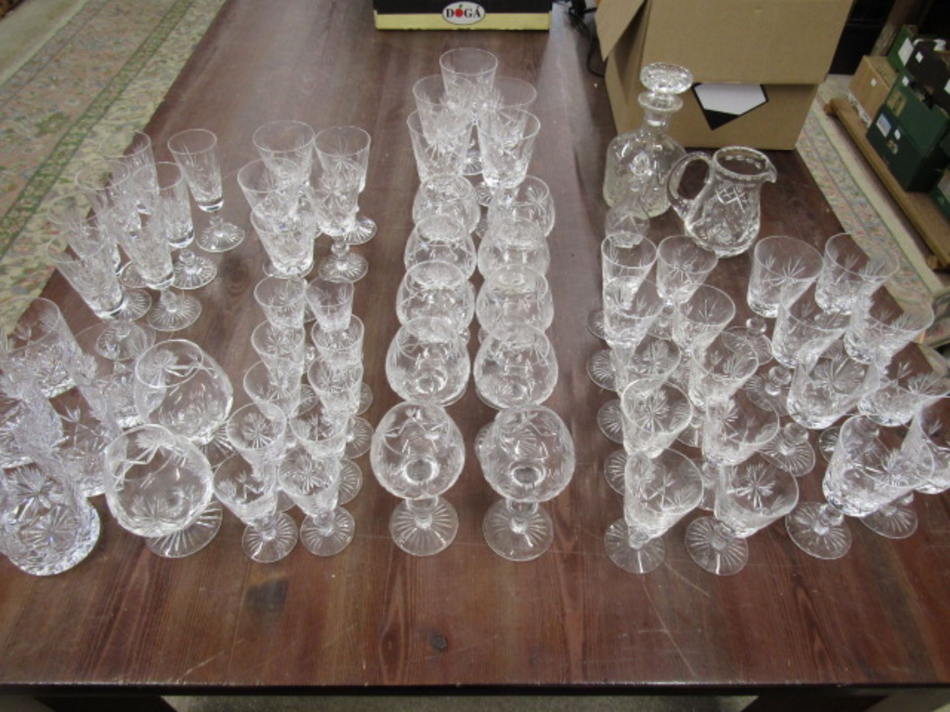 A suite Edinburgh crystal glasses, a decanter and 2 jugs, some part sets
