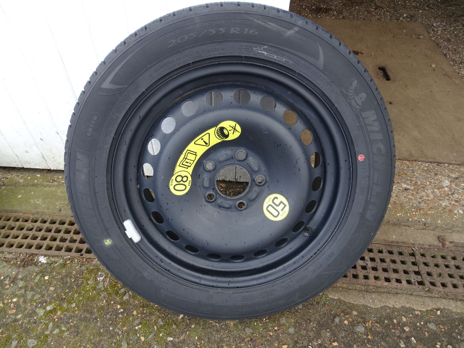 Unused spare car wheel with tyre