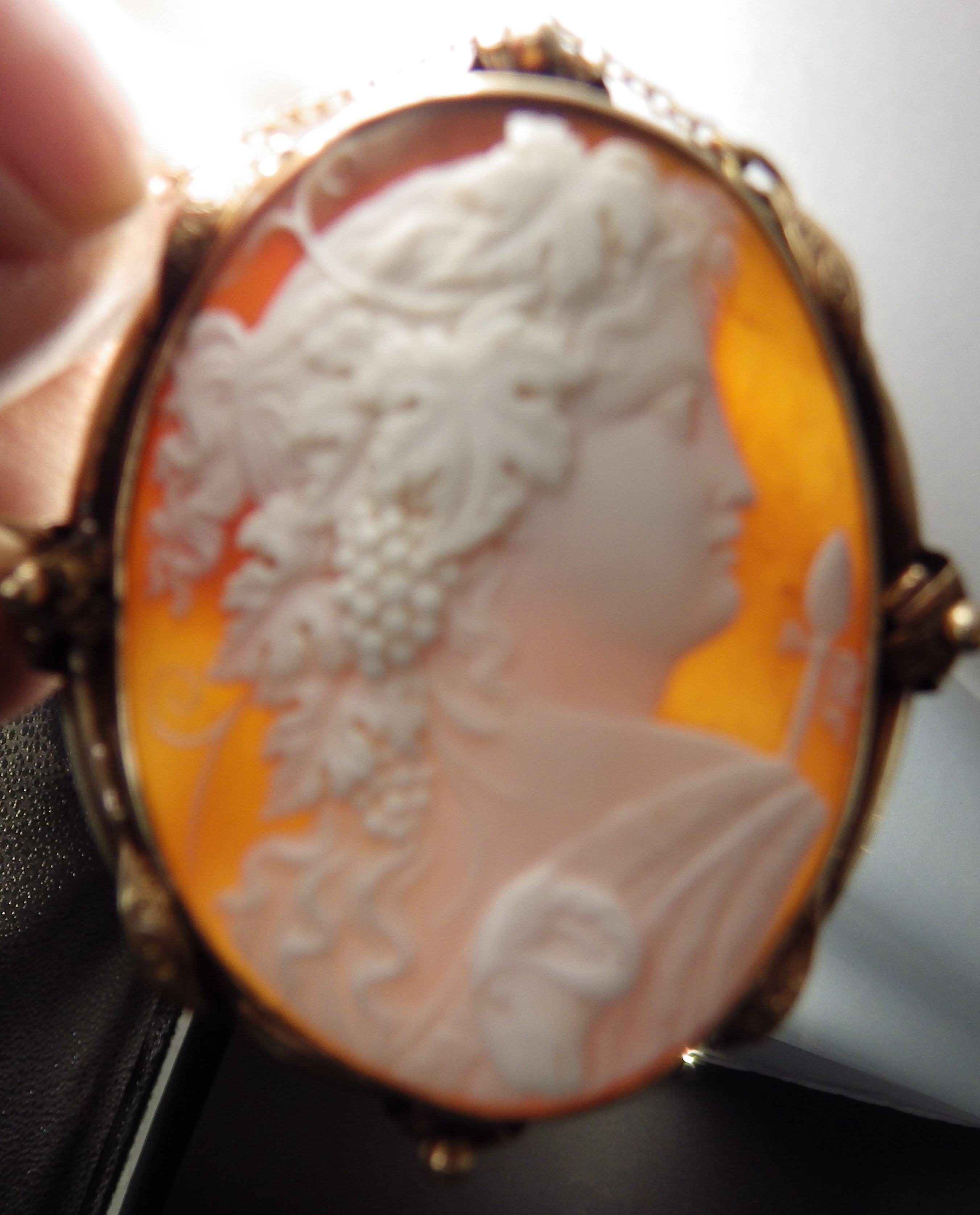 Late Victorian carved shell cameo brooch edged in rose gold, depicting a bacchante in profile, - Image 3 of 3