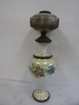 A vintage ceramic based oil lamp