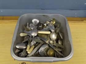 Tub of unsorted cutlery