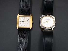 Men's Mark Cross yellow metal bezel watch with leather strap; quartz movement. Measures 1.185" x 1.