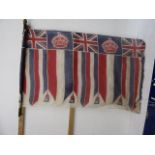 A vintage 'England Made' commemorative flag on pole