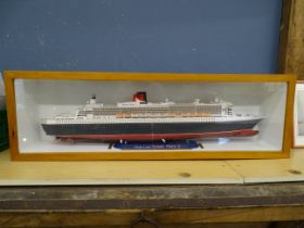 Cased Ocean Liner Queen Mary 2 model ship. Case size H29cm W94cm D17cm approx