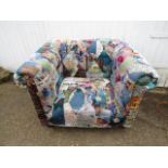 A velour patchwork style club chair in buttoned Chesterfield style  some slight plucks to upholstery