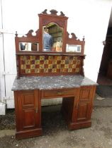 Antique  marble topped washstand with tiled and mirrored back