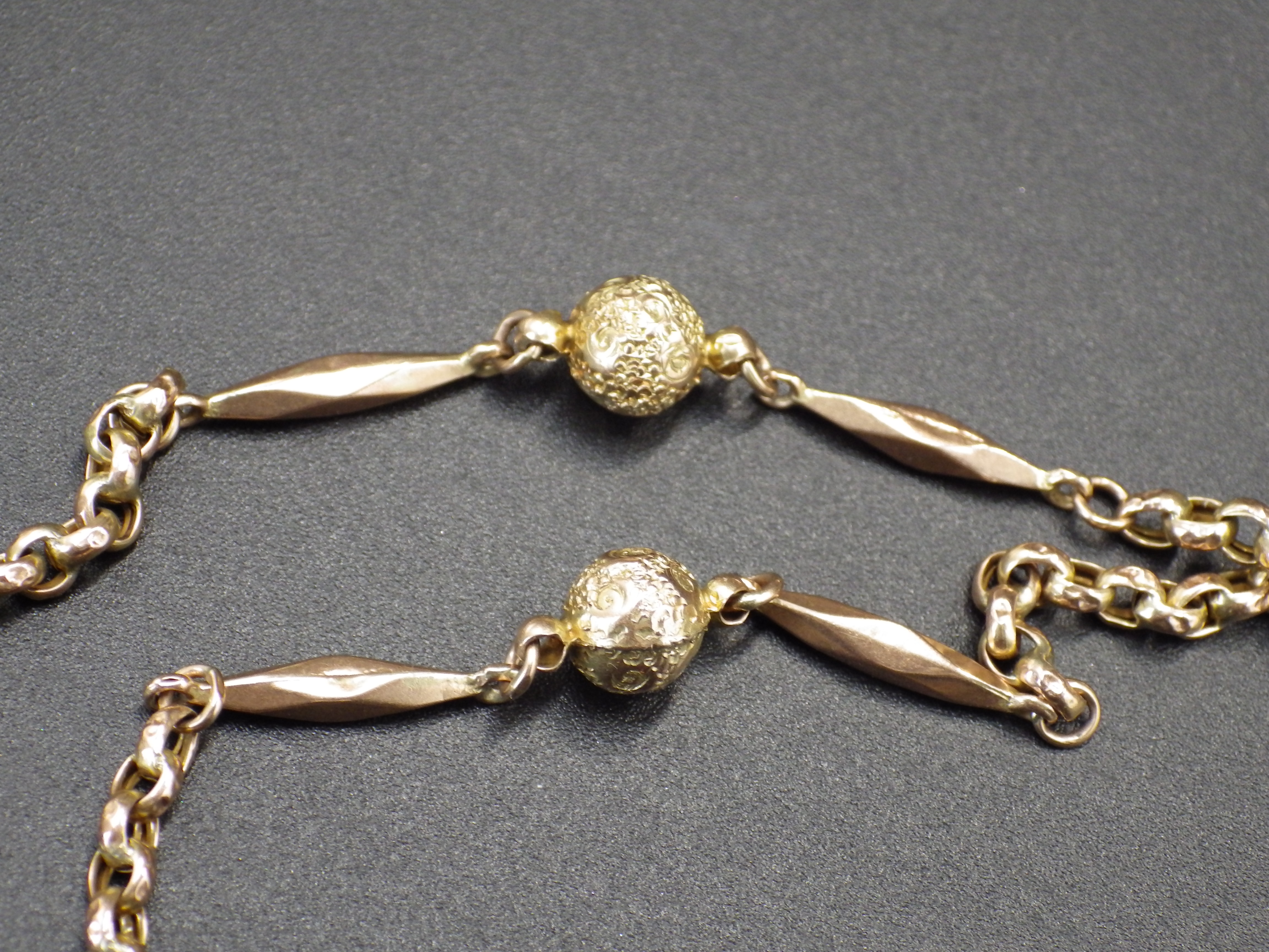 A double lorgnette marked 9 kt, on a gold chain marked 9 ct with decorative sphere detail, the chain - Image 6 of 6