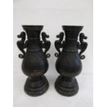A pair black ceramic Oriental vases 38cmH