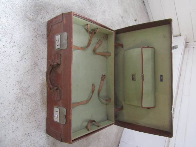 Leather bound suitcase with internal tray