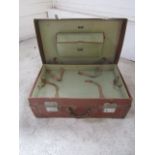 Leather bound suitcase with internal tray