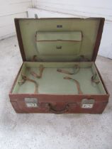 Leather bound suitcase with internal tray