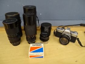 Minolta SRT 100 camera with 3 lenses in bag