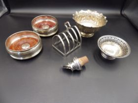 A pair of matching silver wine coasters - London 1997, by John Bull Ltd, a silver toast rack -