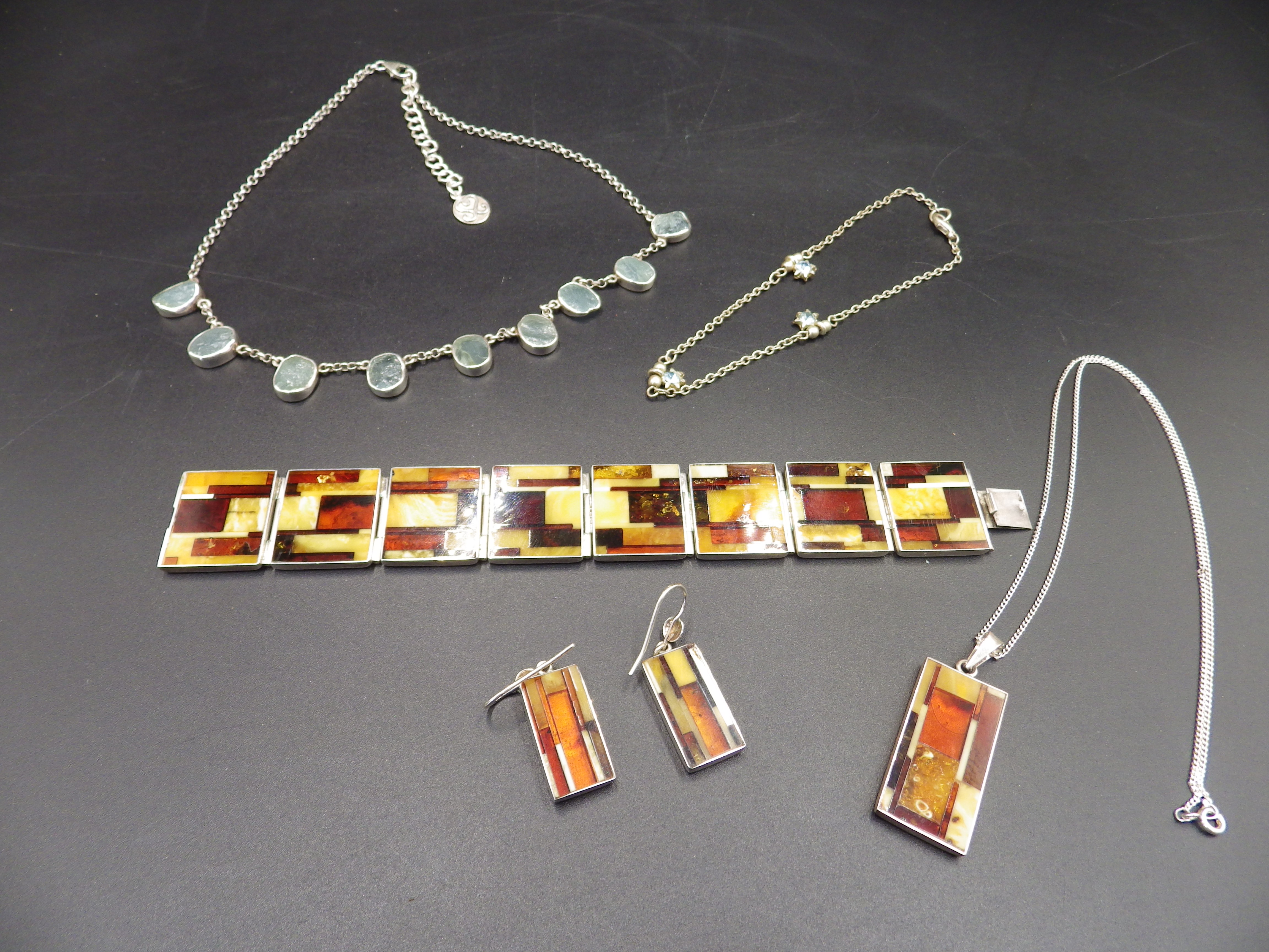 Sterling silver and Baltic amber pendant necklace, bracelet and earings, plus a sterling silver