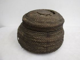 A lidded wicker basket