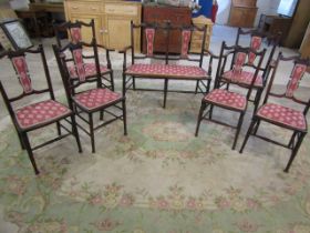 An Edwardian salon suite comprising 4 dining chairs, 2 carver chairs and a 2 seat 'sofa'